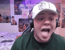 a young man wearing headphones and a hat with the number 23 on it