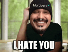 a man wearing a hat that says multiverse on it says i hate you