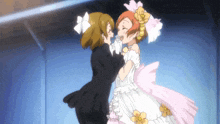 a girl in a wedding dress kisses another girl