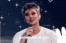 a man in a white shirt is holding a microphone and the words joshua solo de kan are on the screen