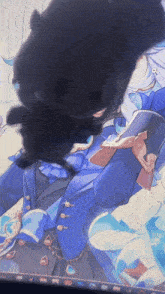 a black cat is laying on top of a drawing of a man in a blue suit