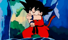 a cartoon character named goku is standing in front of a blue wall