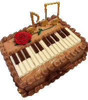 a chocolate cake with chocolate piano keys and a red rose