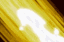 a close up of a white light coming out of a yellow background .
