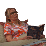 a woman laying on a bed reading a book titled the queen 's dilemma