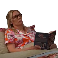 a woman laying on a bed reading a book titled the queen 's dilemma