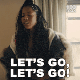 a woman says let 's go let 's go on a screen