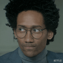 a man wearing glasses and a turtleneck has netflix written on the bottom of his face