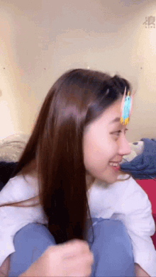 a woman with a sticker on her forehead that says ' i love you '