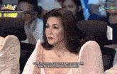 a woman in a white dress says " you 're the love that rescues me when the cold winds rage " on the screen