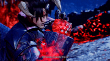 a video game character with horns is holding a red object and saying that vessel surrender it to me .