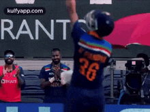 The Blurred Foreground A Proud Background And An Even Happier Man Up Above Watching Them. GIF - The Blurred Foreground A Proud Background And An Even Happier Man Up Above Watching Them. Krunal Pandya GIFs