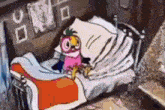 a cartoon bird is sitting on top of a bed with a pillow .