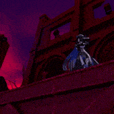 a girl in a witch hat is standing in front of a pyramid