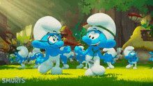 a smurf with a stethoscope is standing next to another smurf