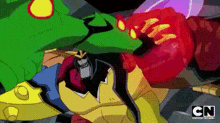 a cartoon character is being attacked by a monster while wearing a green mask .