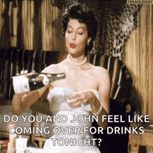 a woman in a white dress pouring a bottle of champagne into a glass