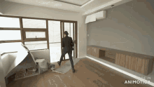a man in a suit is standing in an empty room with the words made in animotica below him