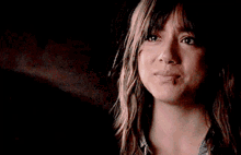 a woman is crying while hugging a man