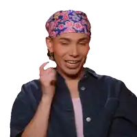 a person wearing a headband and a denim shirt