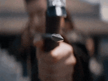 a close up of a person holding a knife in their hand