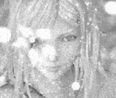 a black and white photo of a woman in a white dress