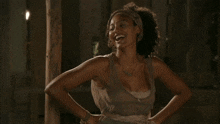 a woman with her arms outstretched and a necklace on her neck