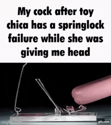 a picture of a mousetrap with a pink sausage sticking out of it
