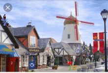 fantastical village windmill cottage butterflies