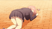 a girl in a school uniform is kneeling on the floor with a can of soda on the ground .