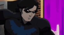 a cartoon of a man in a black suit with a blue bird on his chest .