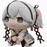 a stuffed animal of a girl with white hair and red ribbons is sitting down .