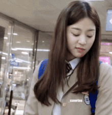 a girl wearing a school uniform has the name sseorina on her chest