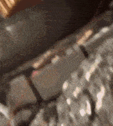 a blurred image of a person 's face with a shadow on the ground