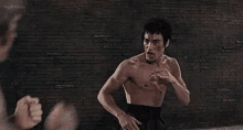 Bruce Lee Chuck Norris GIF - Bruce Lee Chuck Norris Fight GIFs