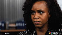 a close up of a woman 's face with the hashtag #svu on the bottom