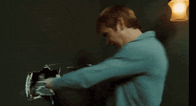a blurry picture of a man covering his mouth with his hands