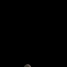 a blurred image of a person 's face with a flame coming out of it