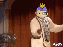 a gif of a monkey wearing a sweater and tie