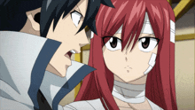 a man and a woman are looking at each other and the woman has a bandage on her head