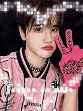 a young man wearing a pink jersey with the name jaeyun de melo on it