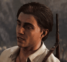 a man in a white shirt is holding a gun on his shoulder