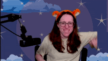 a woman wearing glasses and a tigger headband
