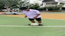 a person standing on a soccer field with a ball in front of them