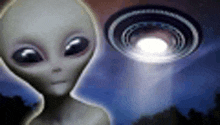 a gray alien is standing in front of an ufo flying in the sky .