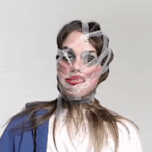 a woman with duct tape covering her face is making a funny face