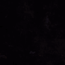 a dark background with a few lines and a blue glowing object
