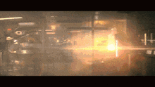 a blurred image of a room with a light shining through the window