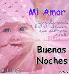 a baby wearing a pink hat with the words mi amor written above it