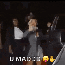 a group of women are standing next to each other and one of them says u maddd